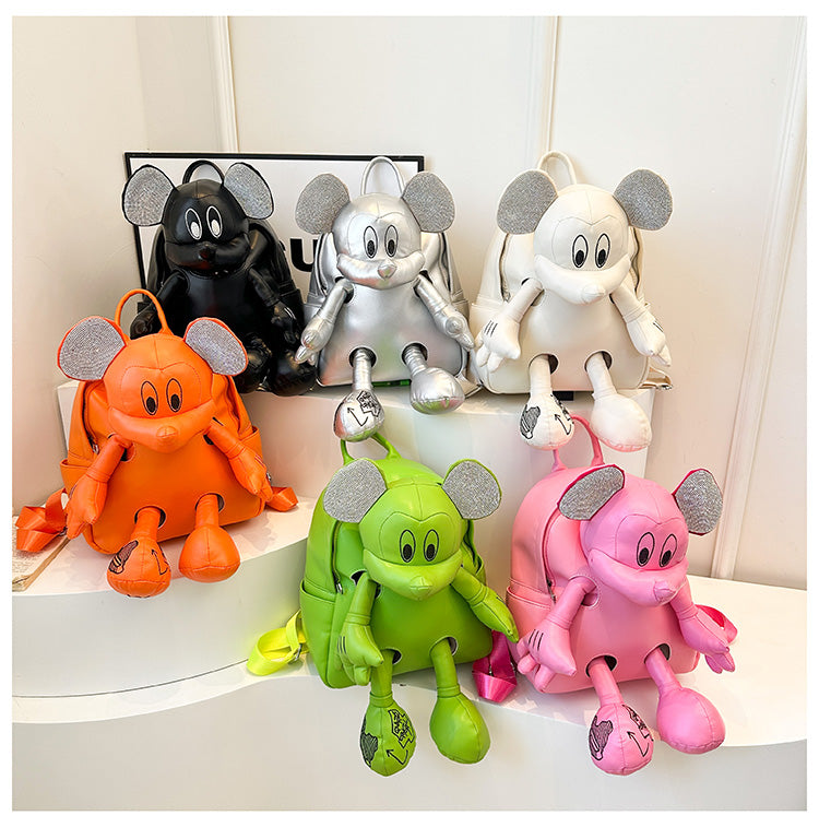 A vibrant collection of six children's backpacks in orange, green, pink, black, silver, and white,