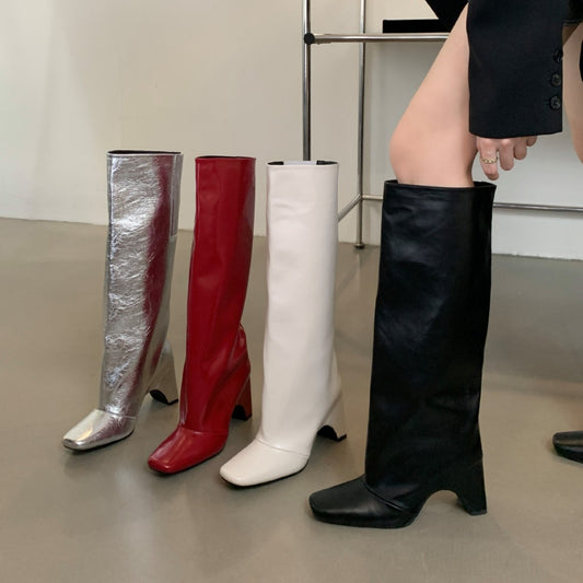 Knee-high wedge boots in silver, red, white, and black. Stylish leather boots for women with wedge heels. Perfect for fashion-forward looks