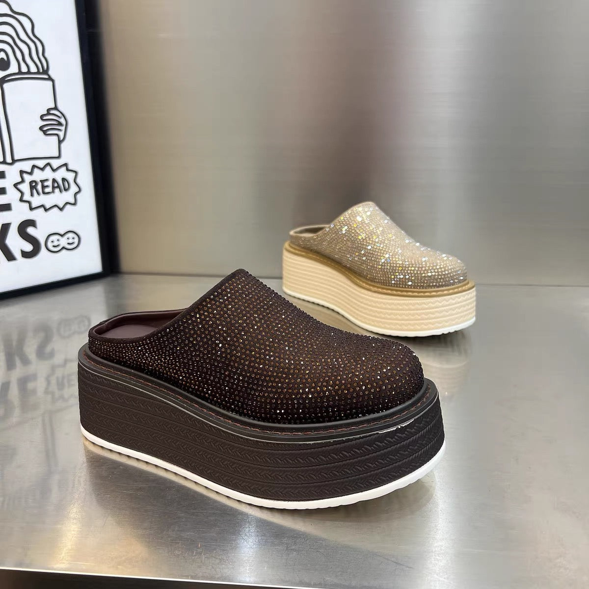 Dark brown and champagne rhinestone platform clogs displayed together