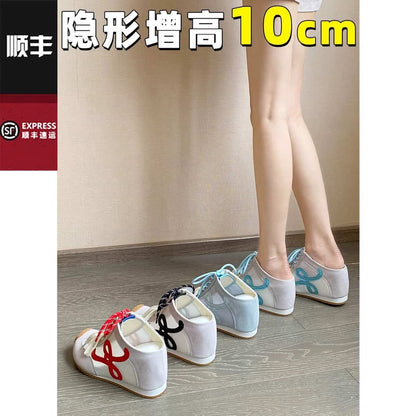 Pair of shoes with text indicating height increase on a plain background