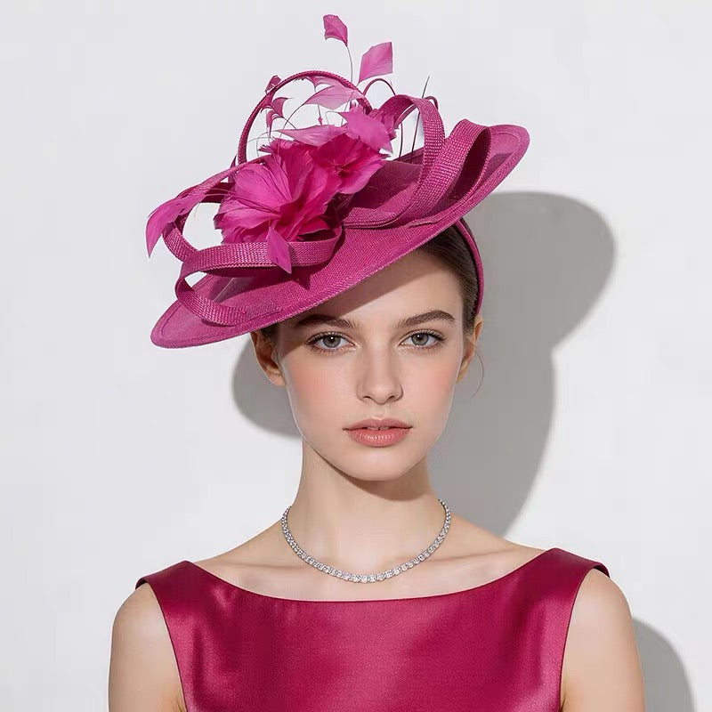 Fuchsia pink feather fascinator hat worn by model