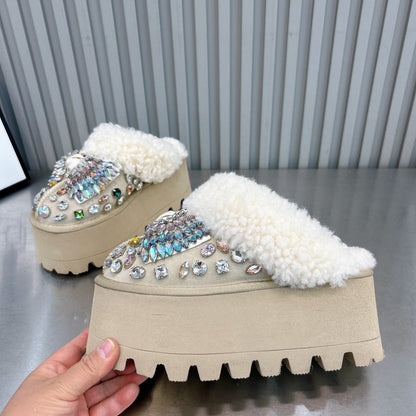 Close-up of beige rhinestone embellished backless platform mules with plush faux fur lining
