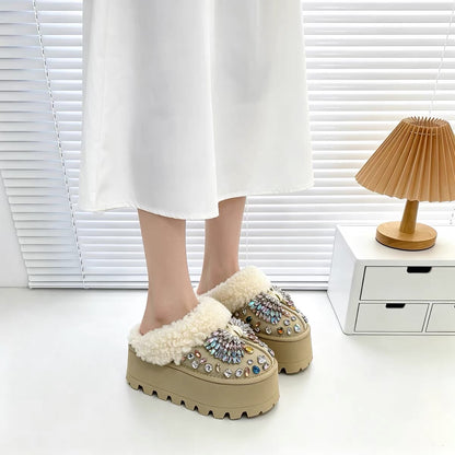 Women's crystal decorated plush platform mules worn with white skirt