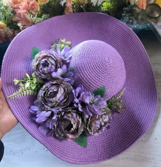 Purple wide-brim straw sun hat decorated with lavender flowers