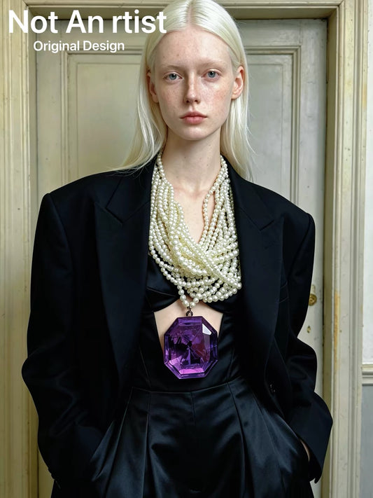Y2K purple gemstone pendant layered faux pearl statement necklace styled with a black outfit