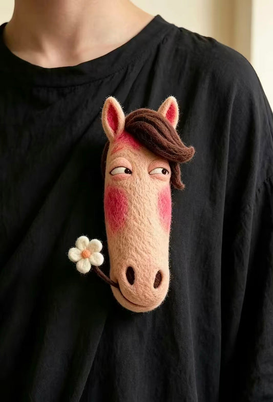 Handmade felt horse zodiac brooch with brown mane, pink cheeks and a small flower