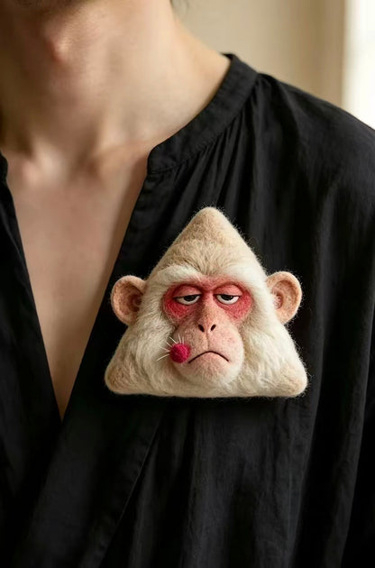 Handmade felt monkey face brooch with cream fur and red cheeks