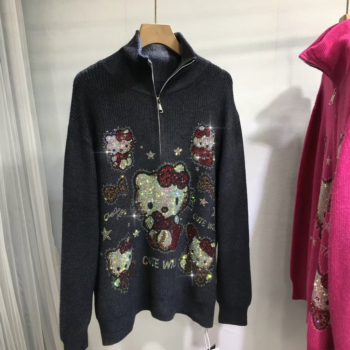 Black oversized rhinestone zip-up knit sweater with character-inspired front design