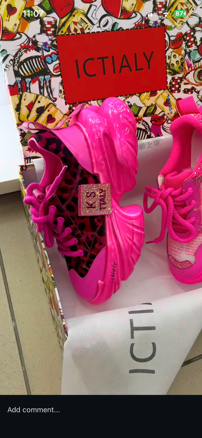 Hot pink leopard-print chunky platform sneakers with embellished side tag