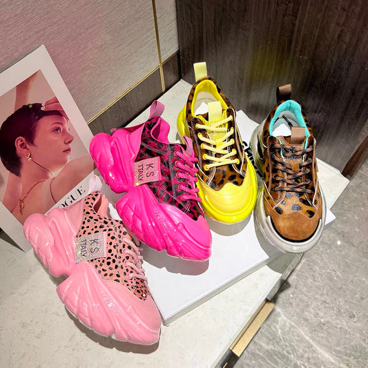 Pink and yellow leopard-print platform sneakers displayed together