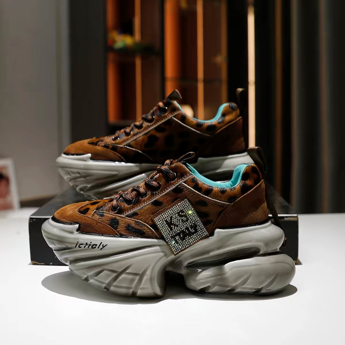 Brown leopard-print sneakers with grey chunky soles