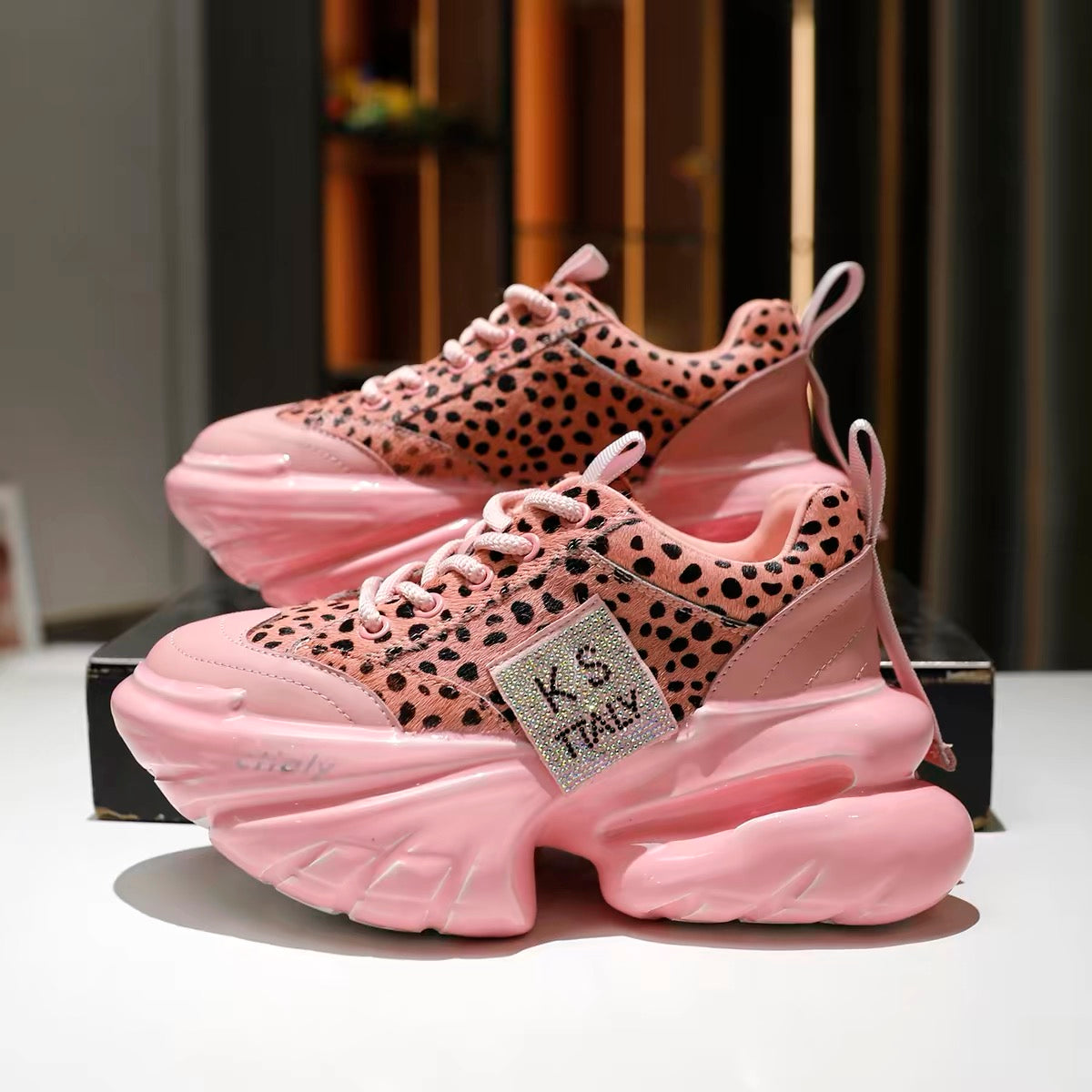 Light pink leopard-print platform sneakers with chunky soles