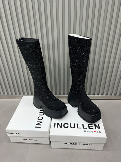 Black sparkling rhinestone knee-high platform boots with chunky black soles