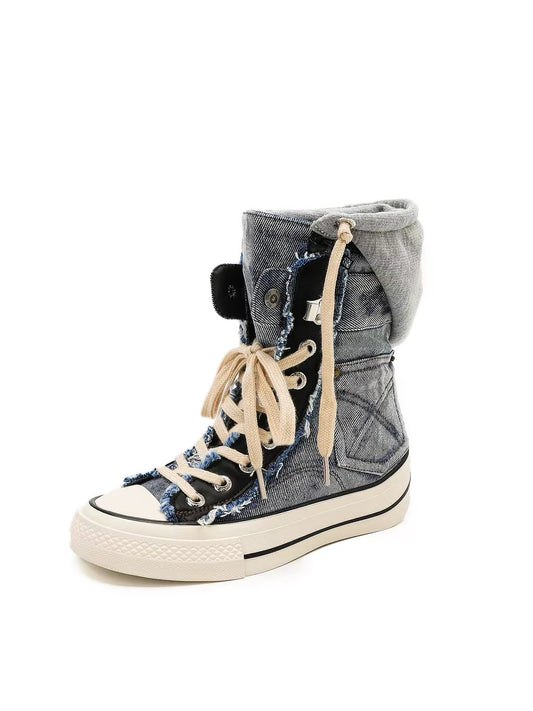 Blue denim high-top platform boots with cream laces, grey turned-down denim cuff, frayed edges and white platform sole, product view