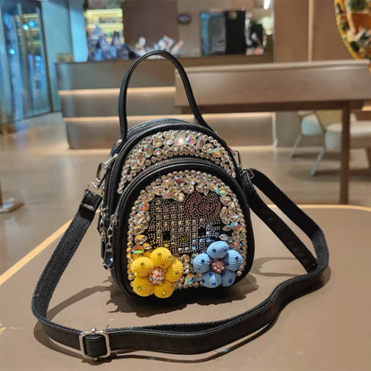 Black rhinestone character mini backpack with floral details