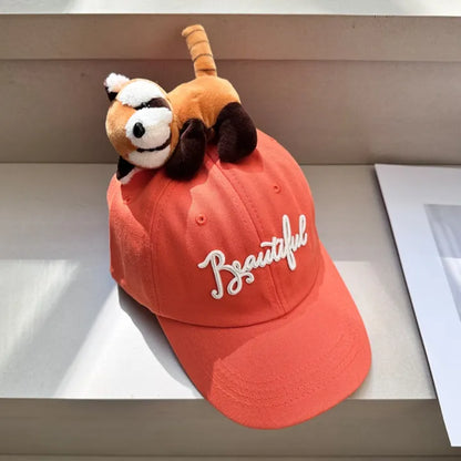 Coral baseball cap with plush animal topper