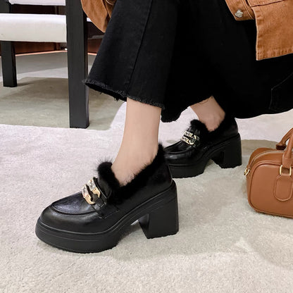 Black faux-fur crystal buckle chunky loafers styled on feet