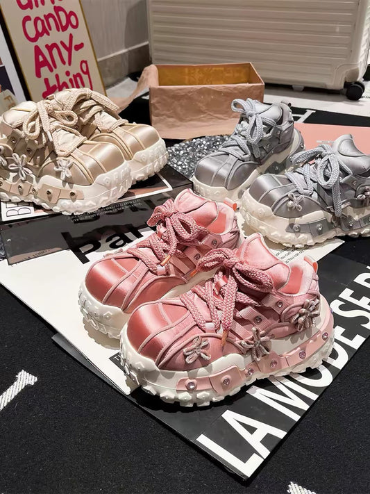Pink genuine leather chunky platform sneakers with braided laces, flower charms and decorative studded sole