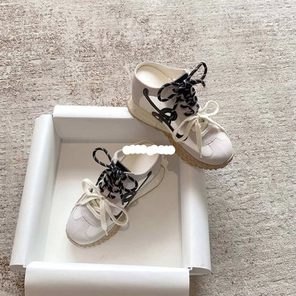 White sneakers with black laces 