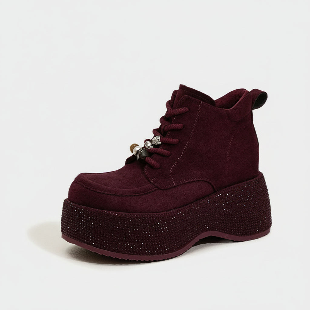 Maroon boot with rhinestone sole on a white background