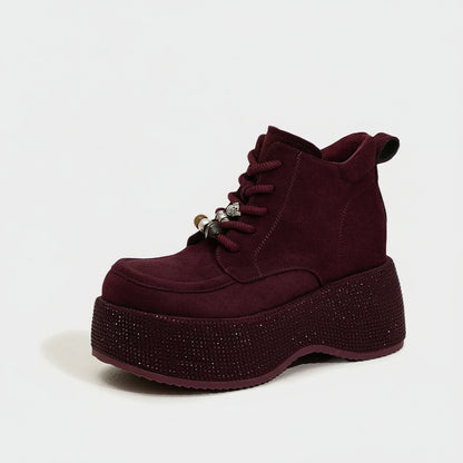 Maroon boot with rhinestone sole on a white background